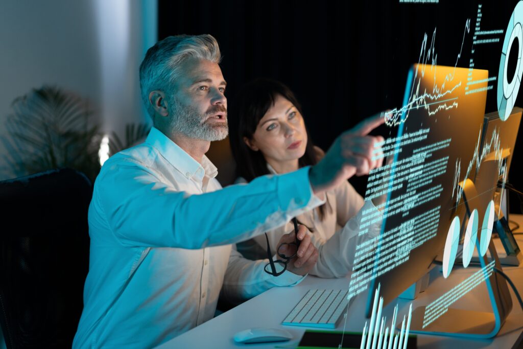 Business,Professionals,Analyzing,Data,On,A,Transparent,Screen,In,A