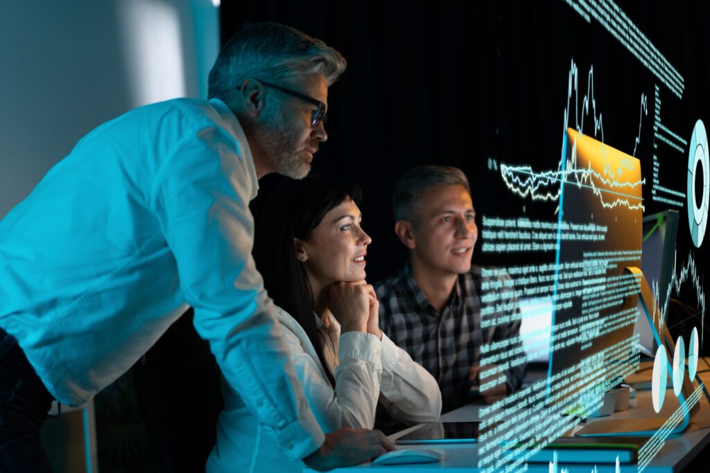Team,Of,Professionals,Analyzing,Digital,Data,On,Futuristic,Screen,,Collaborative