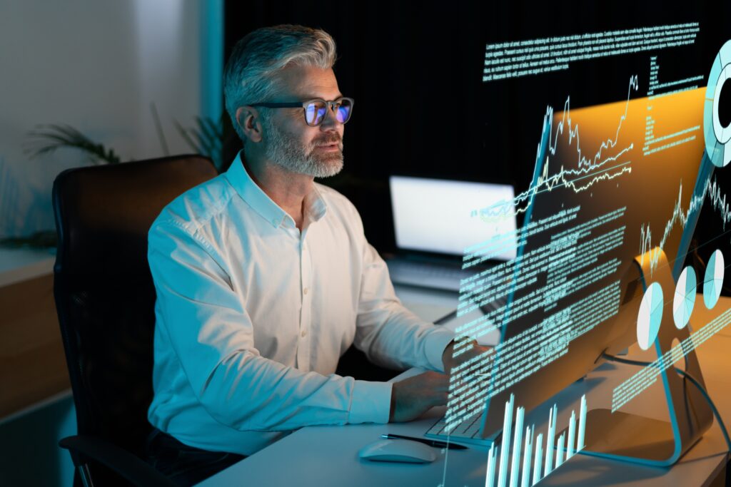 Focused,Professional,Analyzing,Data,On,Futuristic,Digital,Screen,In,Modern